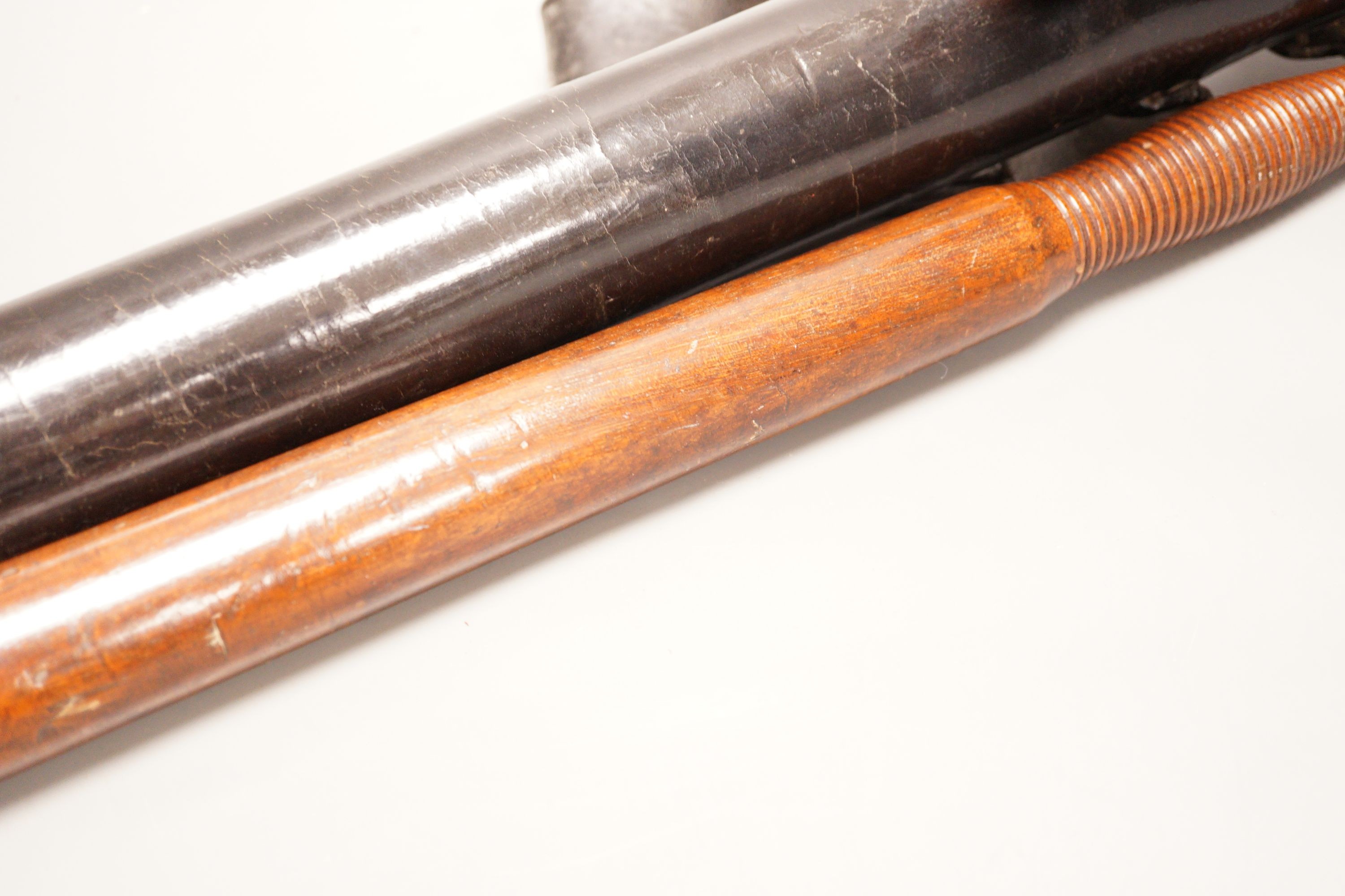 A 19th century constabulary truncheon together with associated spring loaded leather case